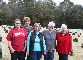 Columbus Chapter members after placing wreaths on graves at Ft. Mitchell National Cemetery in Ft. Mitchell, AL for Wreaths Across America. Members are Regina Ragan, Elaine Tarpley (in the back), Lynne Allen Tate, Dee Shore, and Marjorie Curtis